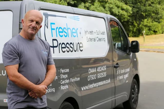 Julian Hansford of Fresher Pressure beside the company van in Haywards Heath