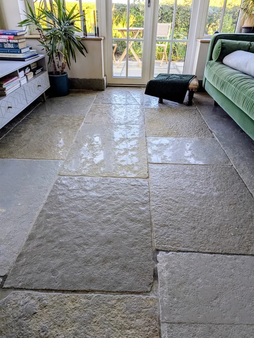 Tumbled limestone floor cleaned and sealed by Fresher Pressure